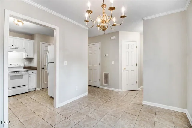 an empty room with closet area