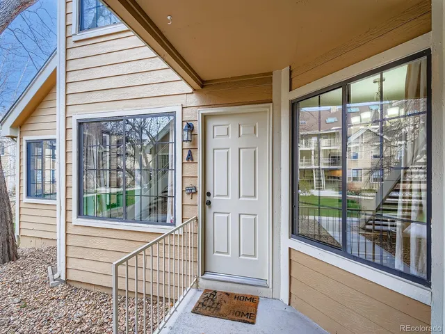 a view of a porch with wooden floor and deck