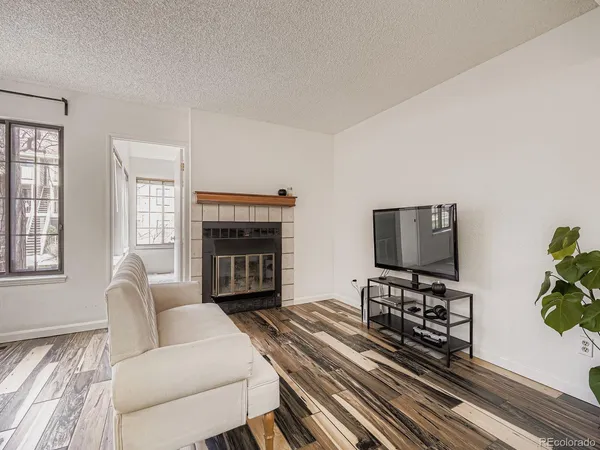a kitchen with stainless steel appliances a stove microwave and sink