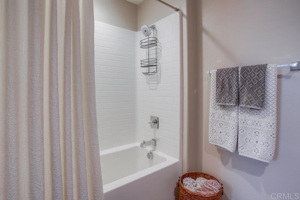 4326 Star Path Way, Unit 1 Oceanside, CA 92056 - Photo 11 of 72 a bathroom with a bathtub a shower and a sink