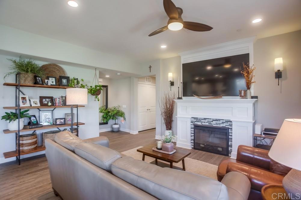 4326 Star Path Way, Unit 1 Oceanside, CA 92056 - Photo 16 of 72 a living room with furniture and a fireplace