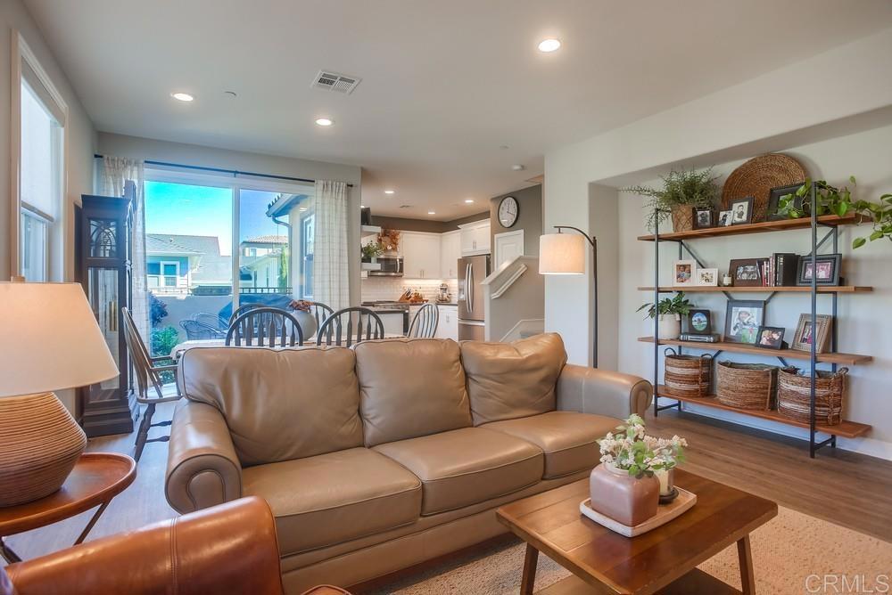 4326 Star Path Way, Unit 1 Oceanside, CA 92056 - Photo 17 of 72 a living room with furniture and a book shelf