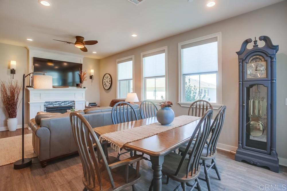 4326 Star Path Way, Unit 1 Oceanside, CA 92056 - Photo 20 of 72 a view of a a dining room with furniture window and wooden floor