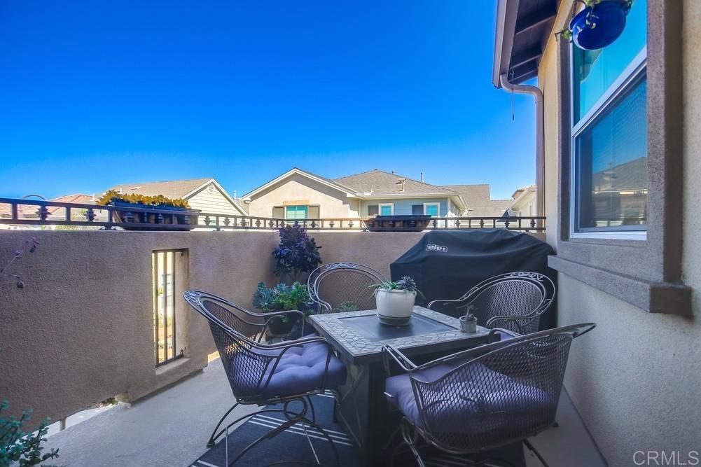 4326 Star Path Way, Unit 1 Oceanside, CA 92056 - Photo 24 of 72 a view of a dining room with furniture and a window