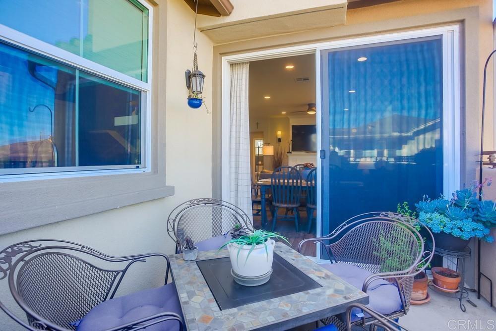 4326 Star Path Way, Unit 1 Oceanside, CA 92056 - Photo 25 of 72 a dining room with furniture and potted plant