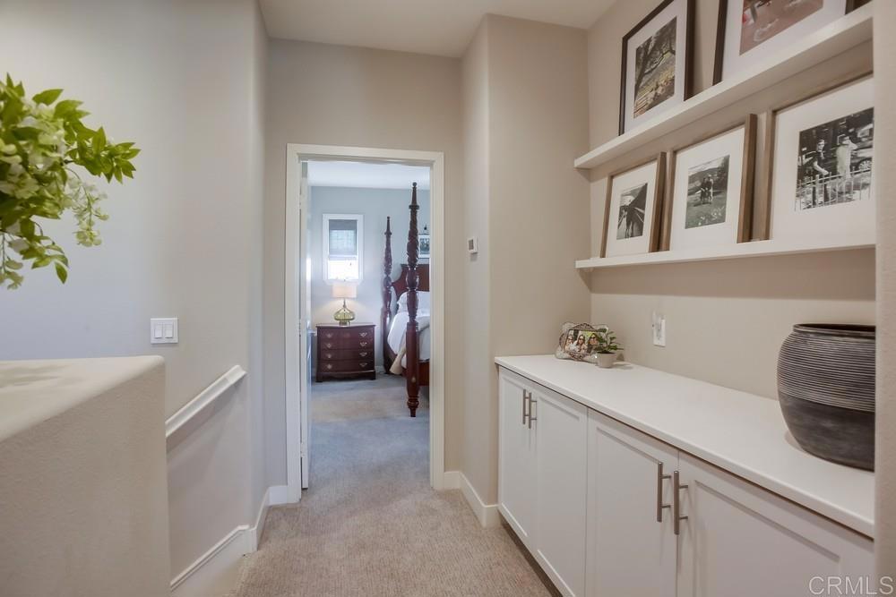 4326 Star Path Way, Unit 1 Oceanside, CA 92056 - Photo 37 of 72 a en suite bathroom with a sink and a mirror
