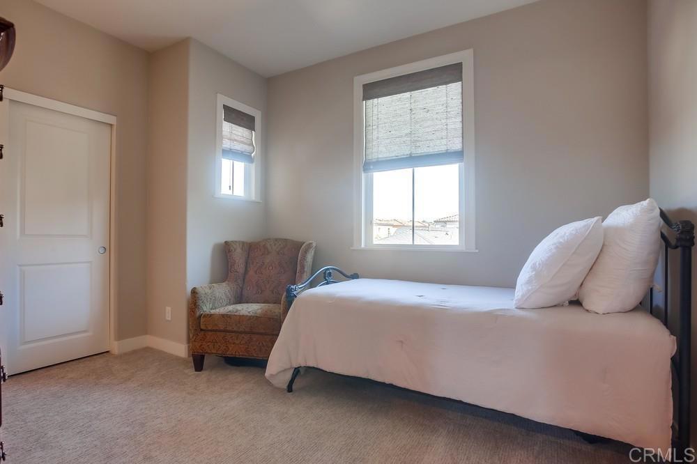 4326 Star Path Way, Unit 1 Oceanside, CA 92056 - Photo 49 of 72 a bedroom with a bed and a window