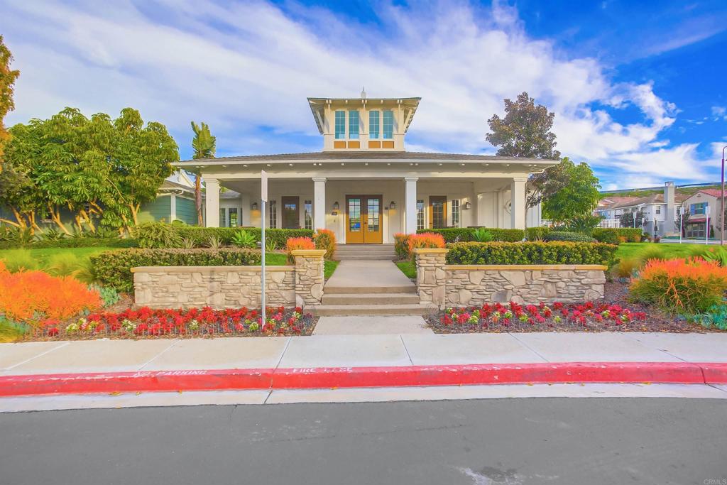 4326 Star Path Way, Unit 1 Oceanside, CA 92056 - Photo 57 of 72 a front view of house with yard and flowers around