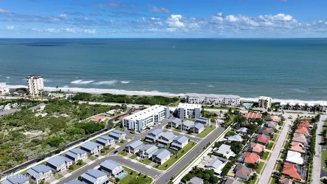a view of a swimming pool with lounge chairs