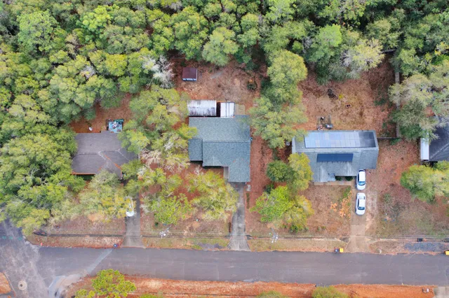 an aerial view of house with yard