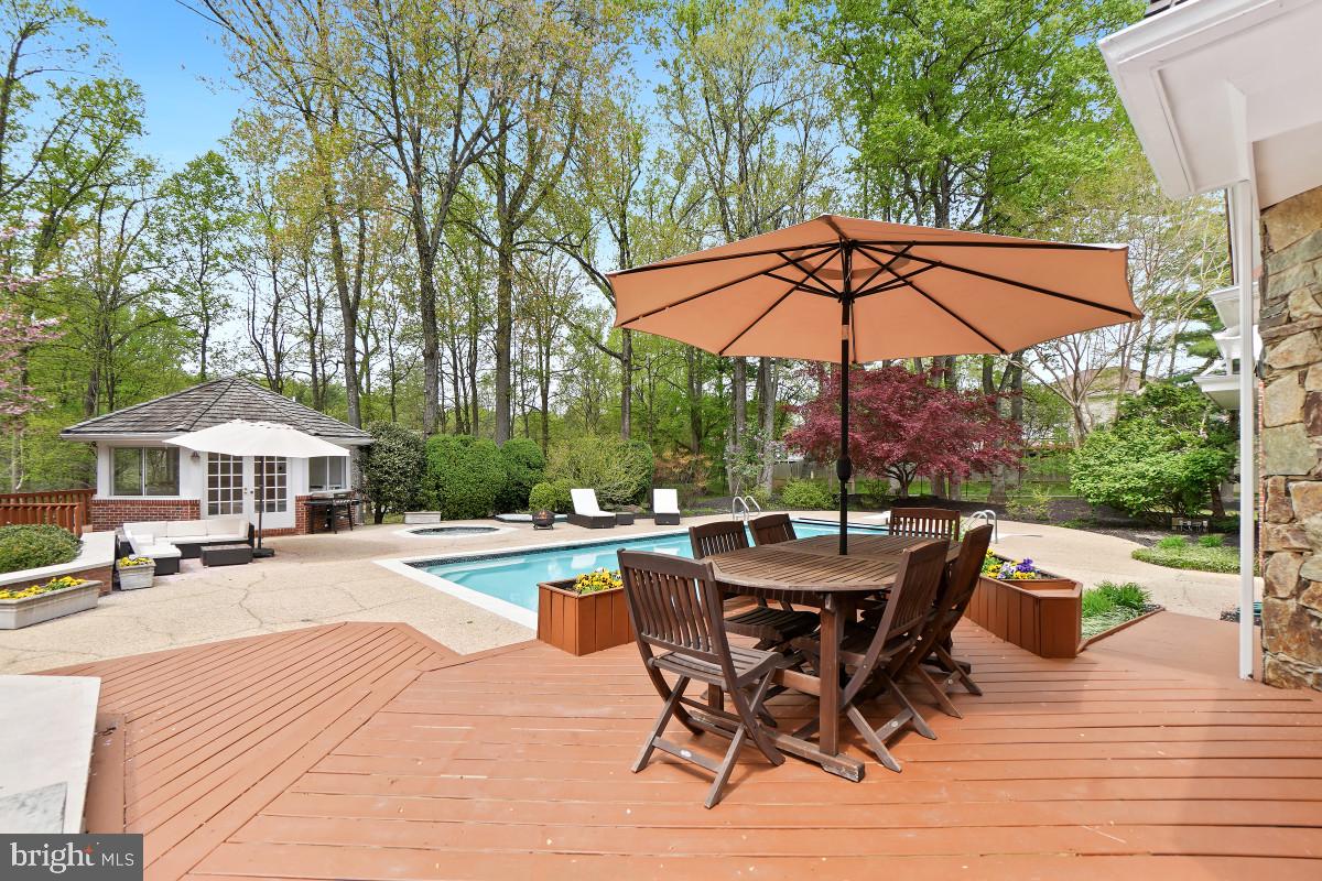 9704 Kendale Road Potomac, MD 20854 - Photo 51 of 70 Serene backyard oasis with poolside charm.