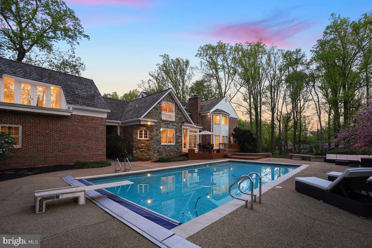 9704 Kendale Road Potomac, MD 20854 - Photo 55 of 70 Serene poolside retreat at dusk.