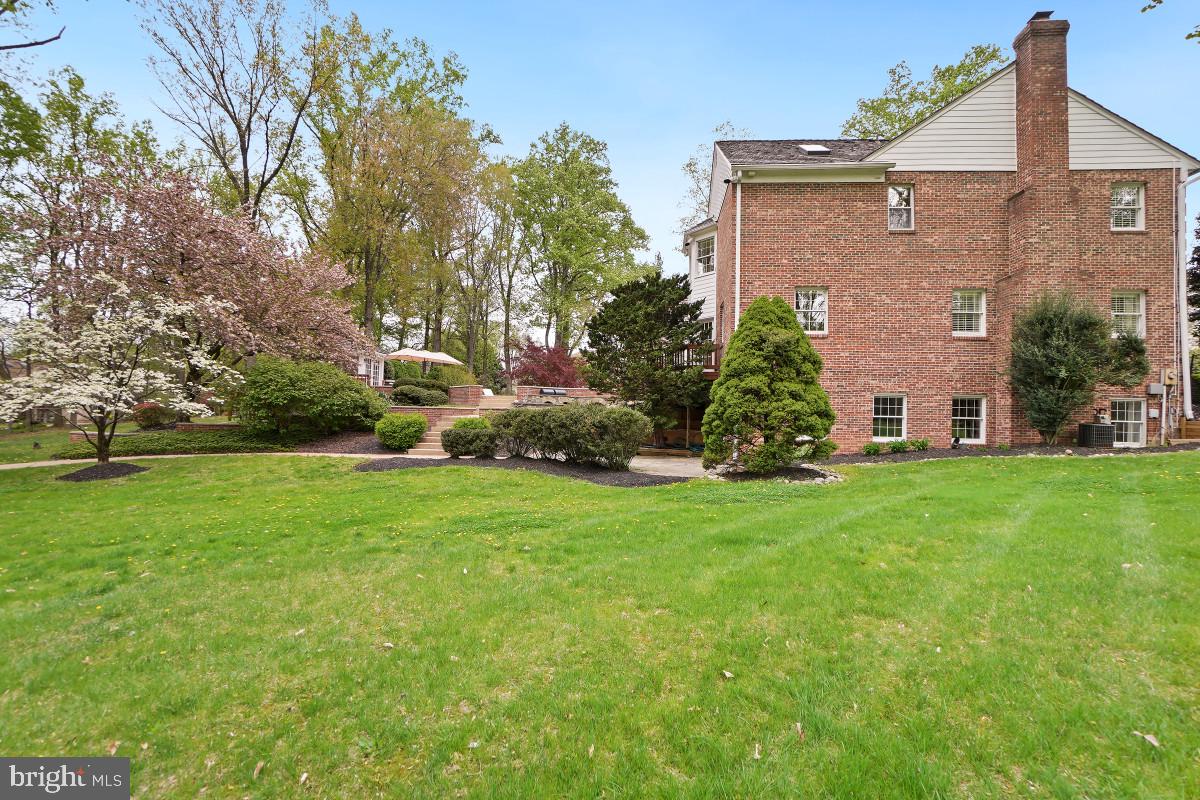 9704 Kendale Road Potomac, MD 20854 - Photo 57 of 70 Charming brick home with lush greenery.