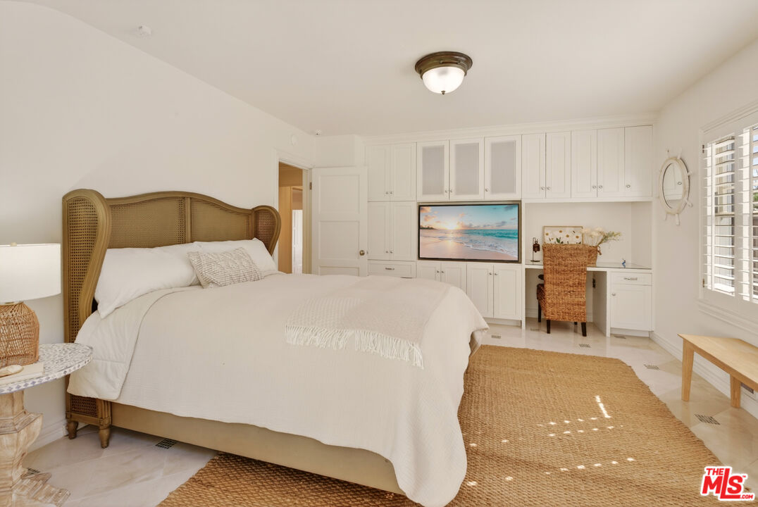 31202 Broad Beach Road Malibu, CA 90265 - Photo 15 of 38 a bed room with a bed and a tv
