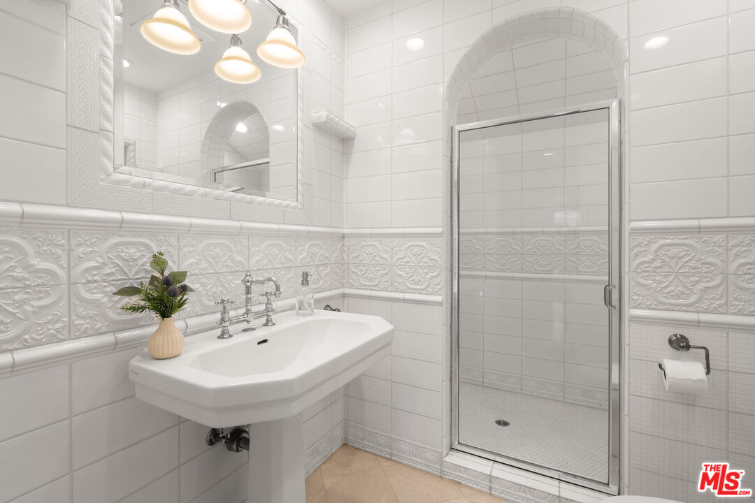 31202 Broad Beach Road Malibu, CA 90265 - Photo 18 of 38 a bathroom with a sink shower and a mirror