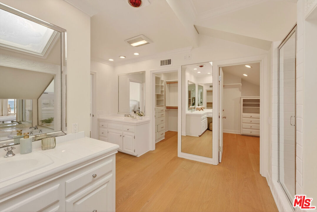 31202 Broad Beach Road Malibu, CA 90265 - Photo 27 of 38 a bathroom with a double vanity sink mirror and shower