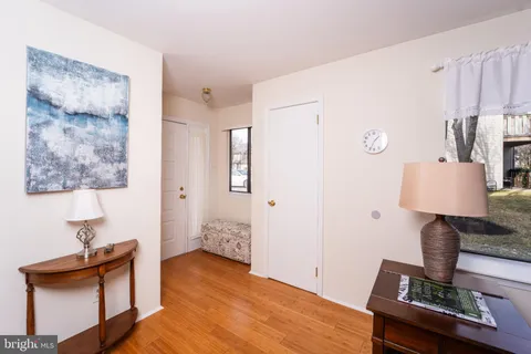 a view of room with furniture and wooden floor