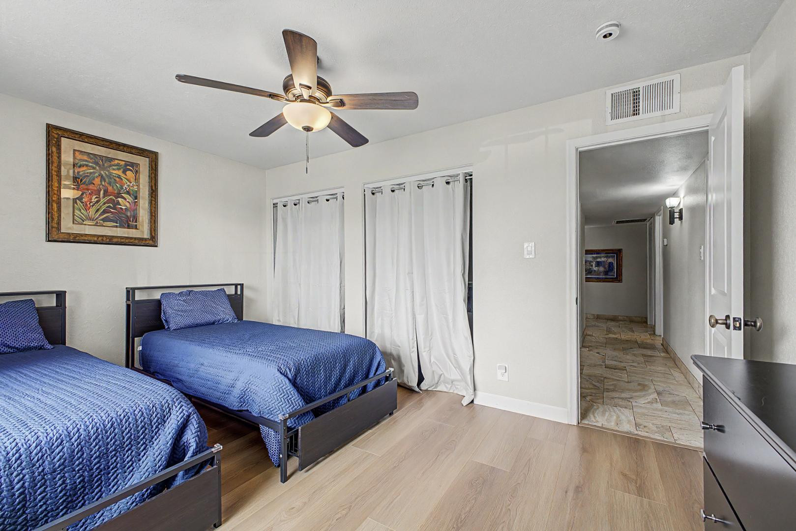 3346 East Cochise Road Phoenix, AZ 85028 - Photo 26 of 40 a bedroom with two beds and a ceiling fan