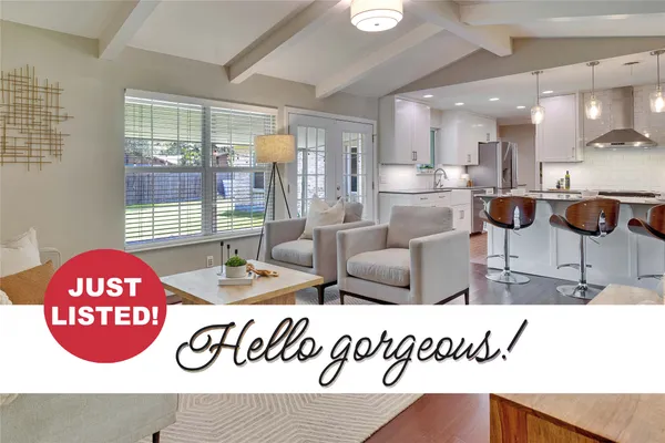 a view of kitchen with kitchen island dining table and chairs