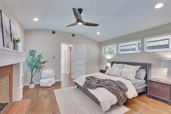 a spacious bedroom with a large bed and a couch