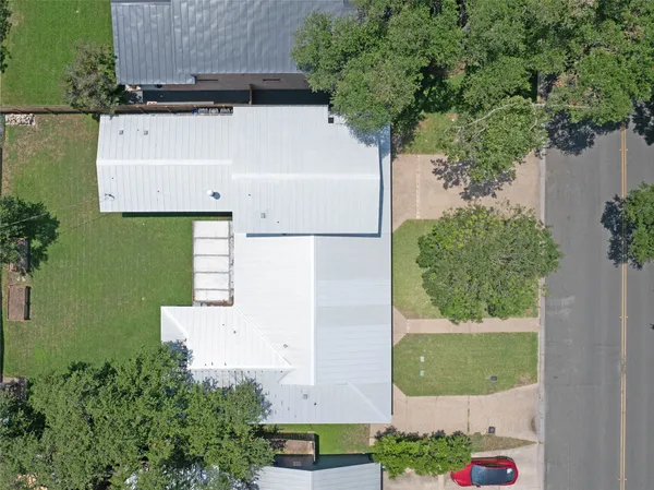 an aerial view of residential house with outdoor space and swimming pool