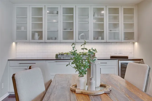a vase of flowers sitting on a dining table