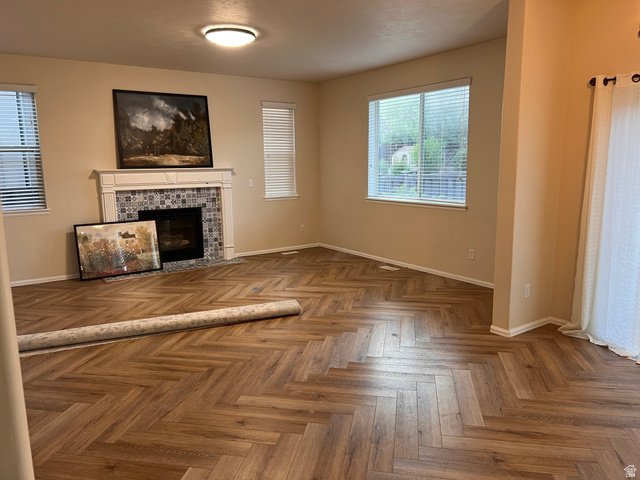 2001 Fielding Hill Lane Draper, UT 84020 - Photo 5 of 21 Unfurnished living room with a tile fireplace and parquet floors
