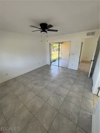 a view of a livingroom and a window