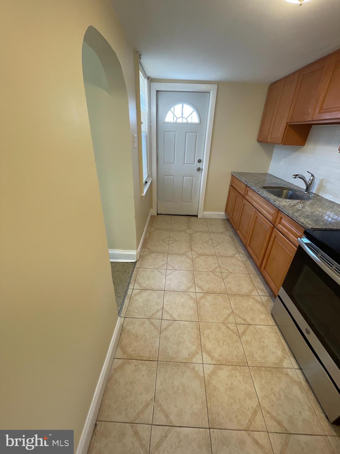 1344 Argus Road Camden, NJ 08104 - Photo 3 of 10 a bathroom with a sink a toilet and a mirror