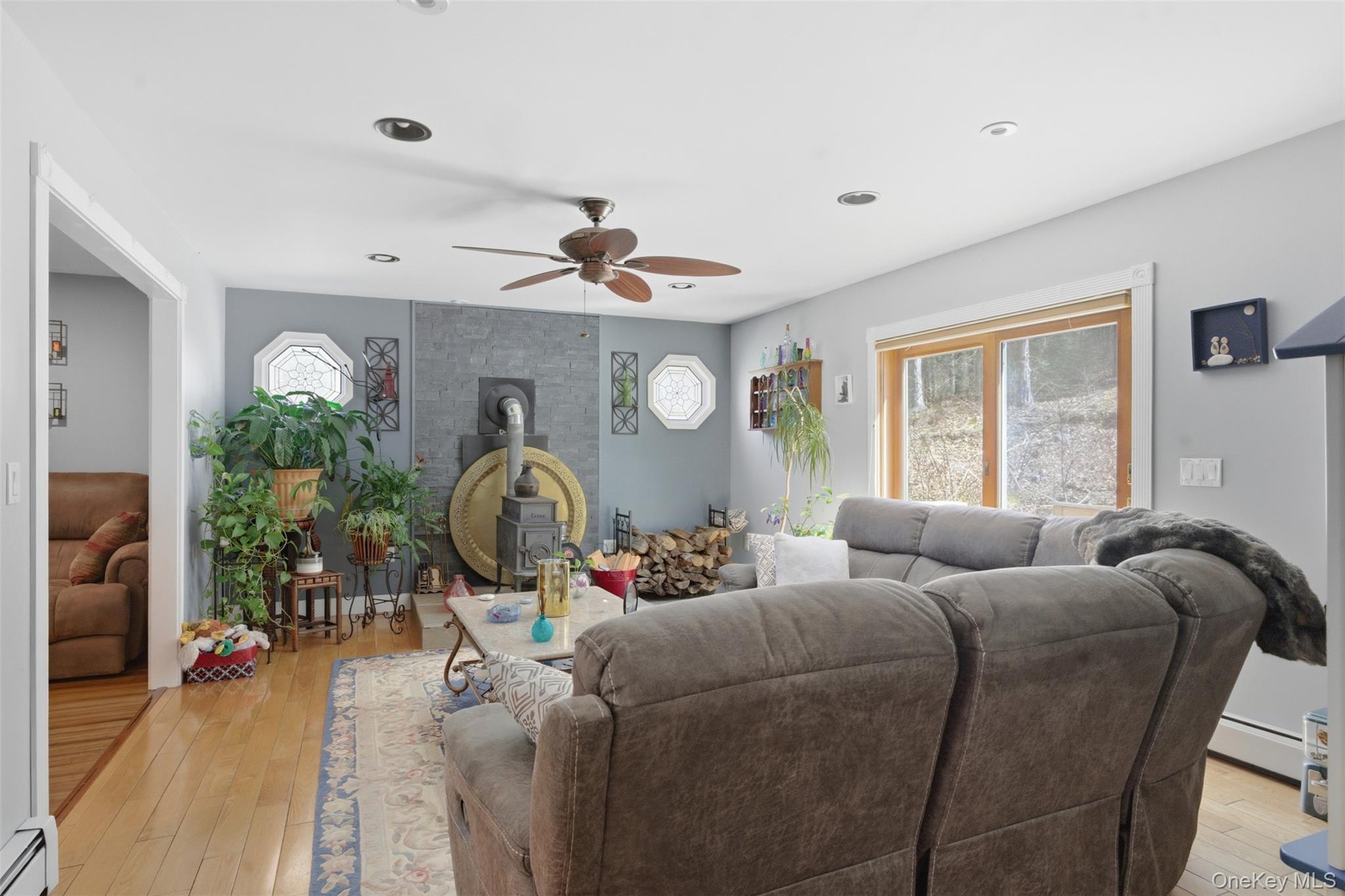 1285 Lakes Road Monroe, NY 10950 - Photo 8 of 45 a living room with furniture a chandelier and a window
