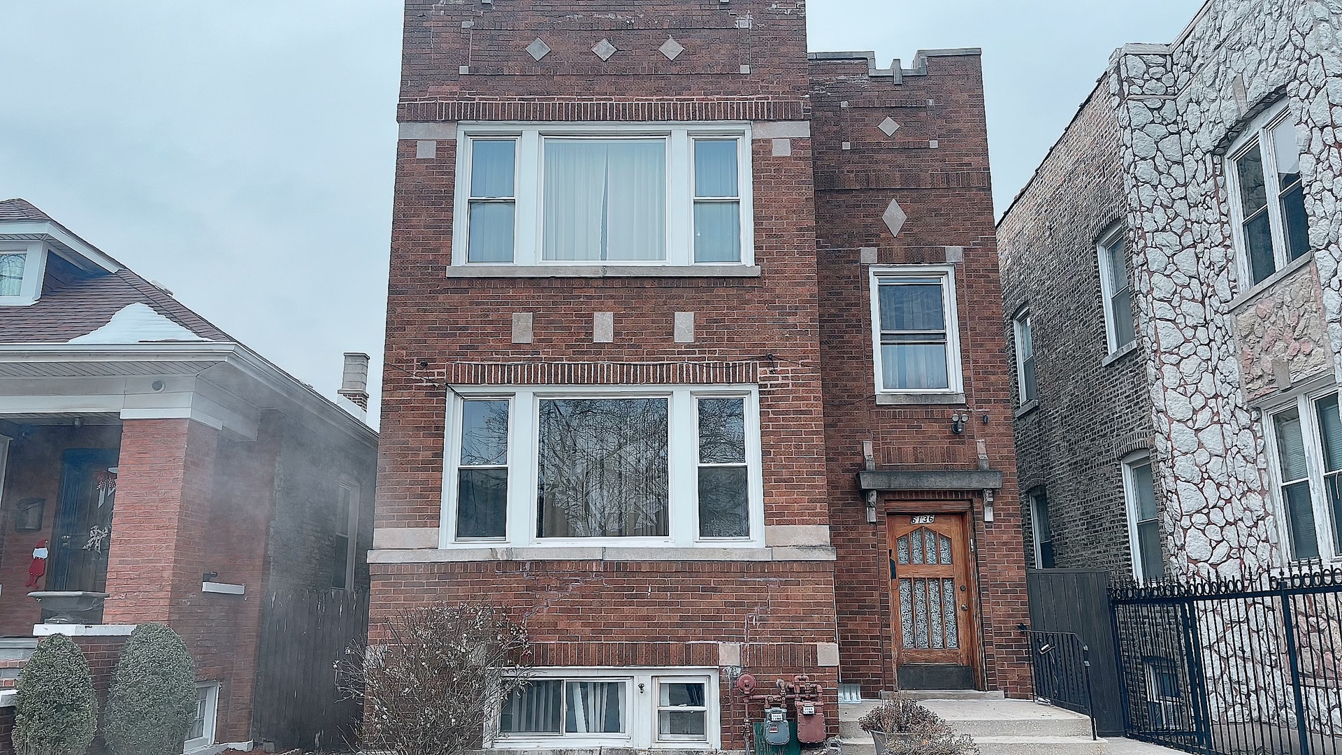 6136 South Mozart Street, Unit 2 Chicago, IL 60629 - Photo 1 of 1 a front view of a multi story building
