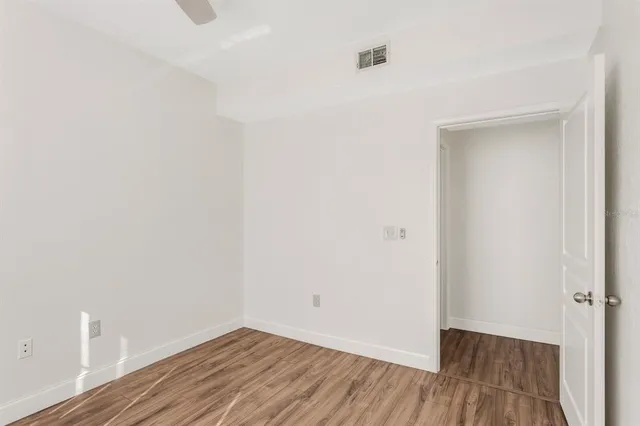 a view of a small space with wooden floor