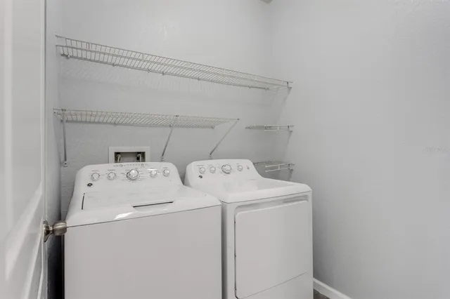 a utility room with dryer and washer