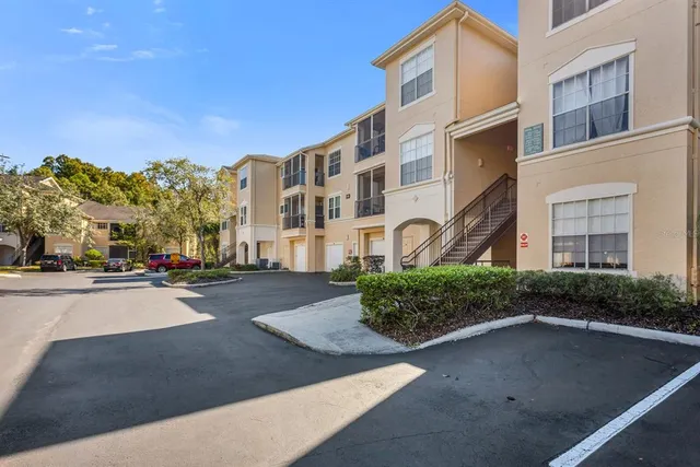 a city street lined with buildings and trees