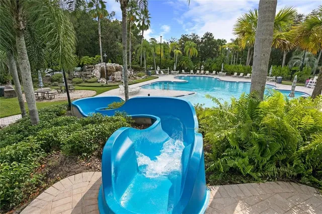 a view of a swimming pool with a patio