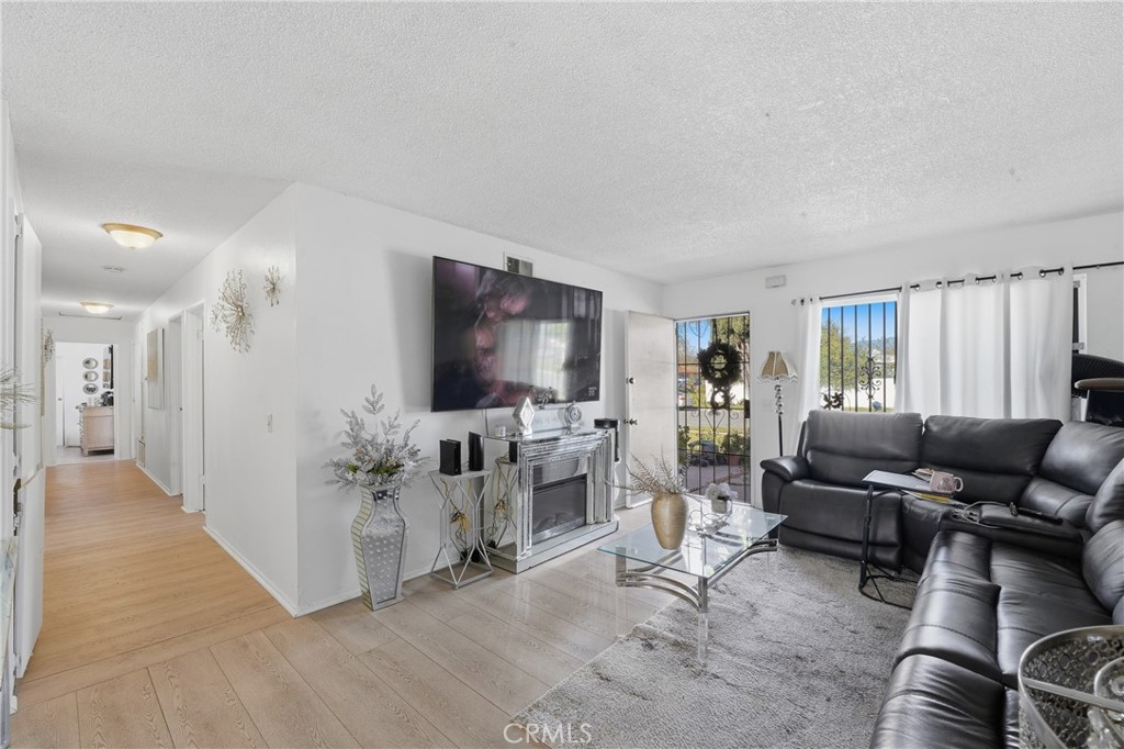 645 West Winchester Drive Rialto, CA 92376 - Photo 6 of 22 a living room with furniture and a flat screen tv