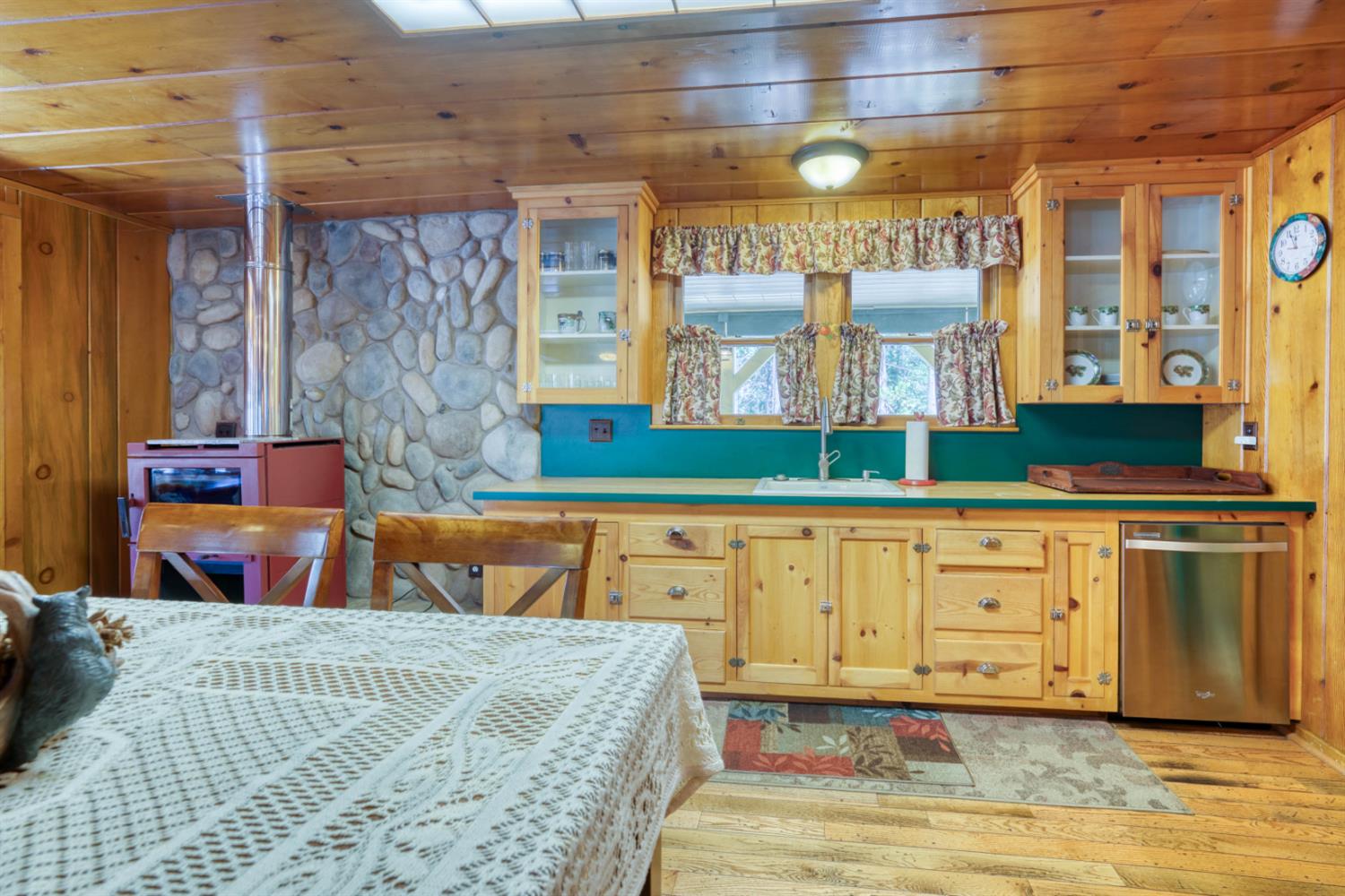 42025 Tollhouse Road Shaver Lake, CA 93664 - Photo 29 of 64 a bed room with a bed and cabinets