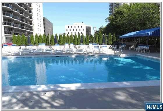 2077 Center Street, Unit 9B Fort Lee, NJ 07024 - Photo 16 of 17 a view of swimming pool with outdoor seating