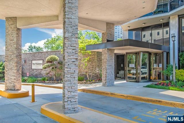 2077 Center Street, Unit 9B Fort Lee, NJ 07024 - Photo 2 of 17 a front view of a house with a porch