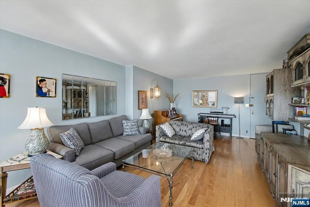 2077 Center Street, Unit 9B Fort Lee, NJ 07024 - Photo 4 of 17 a living room with furniture and a couch