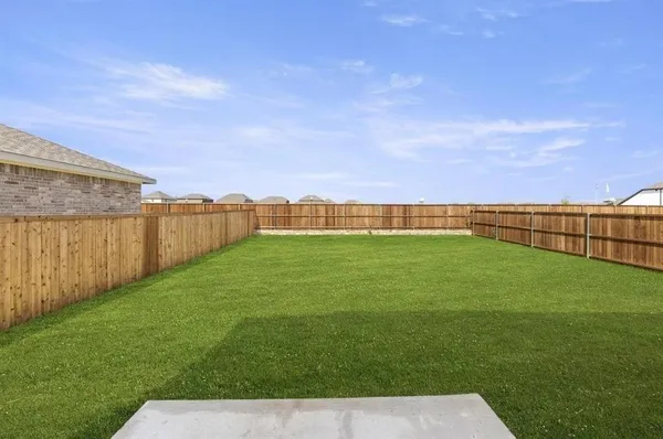 a view of a field with a big yard