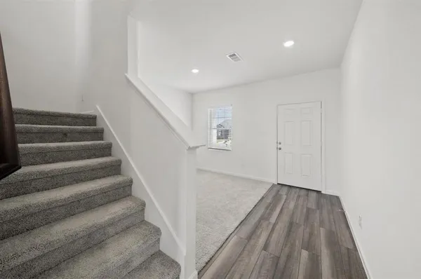 a view of entryway with wooden floor