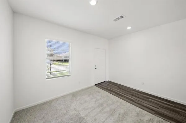 an empty room with windows