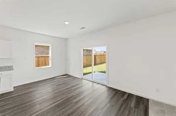 a kitchen with granite countertop a stove and a sink
