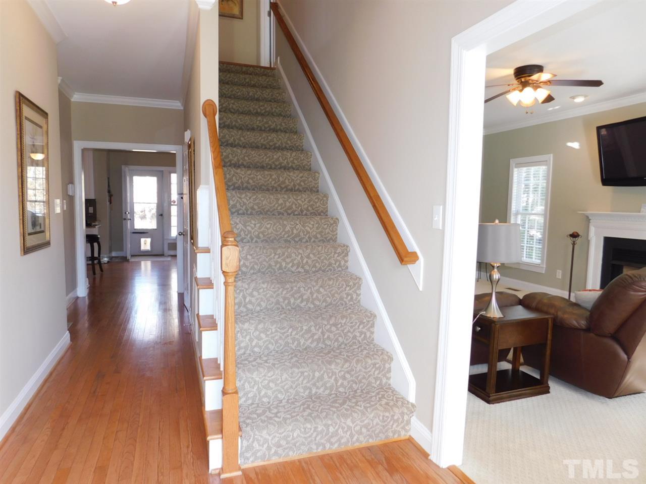 9247 Shallcross Way Raleigh, NC 27617 - Photo 3 of 25 a view of entryway and hall with wooden floor