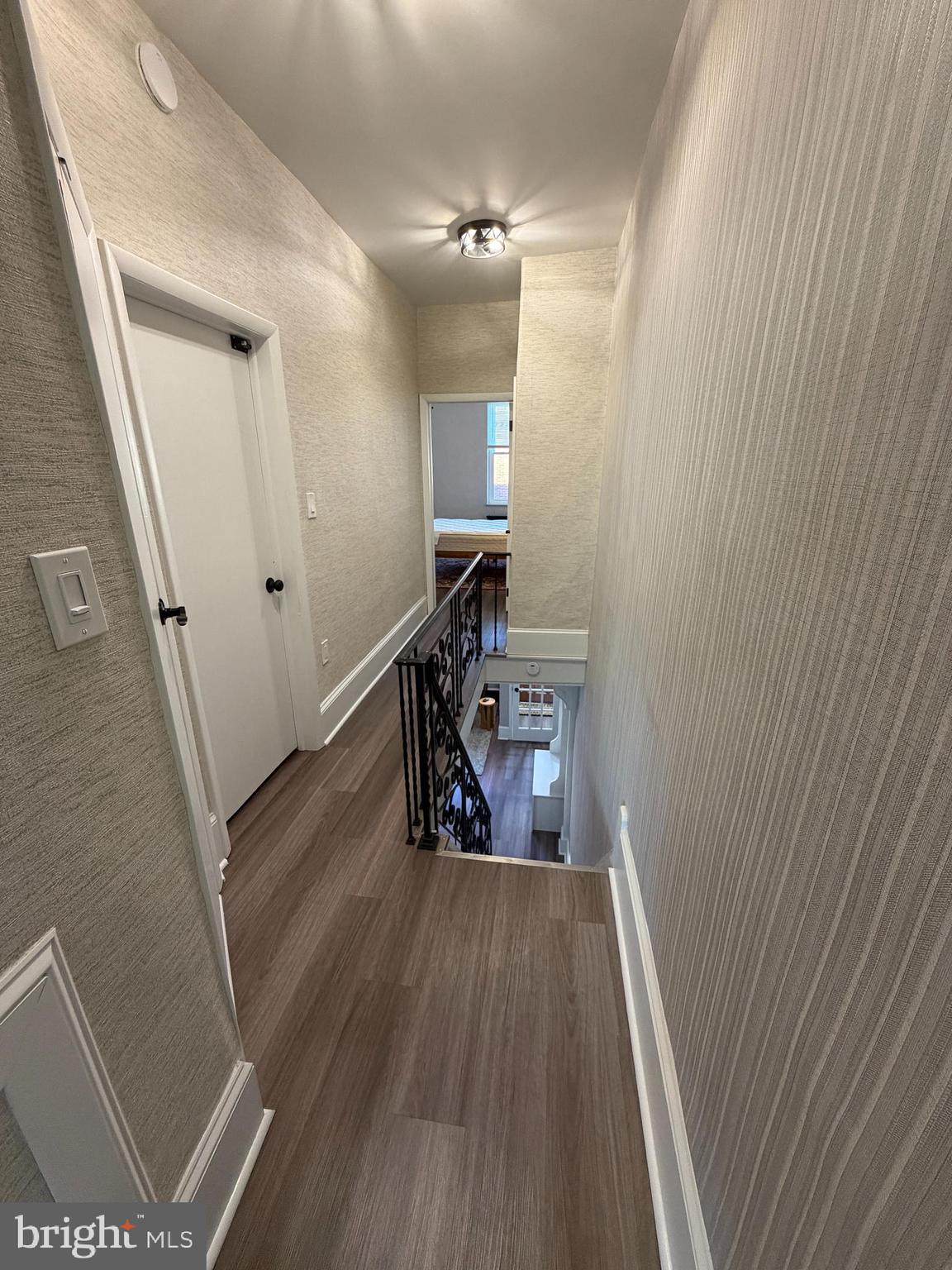 1946 Fitzgerald Street Philadelphia, PA 19145 - Photo 13 of 18 a view of a hallway with wooden floor and staircase