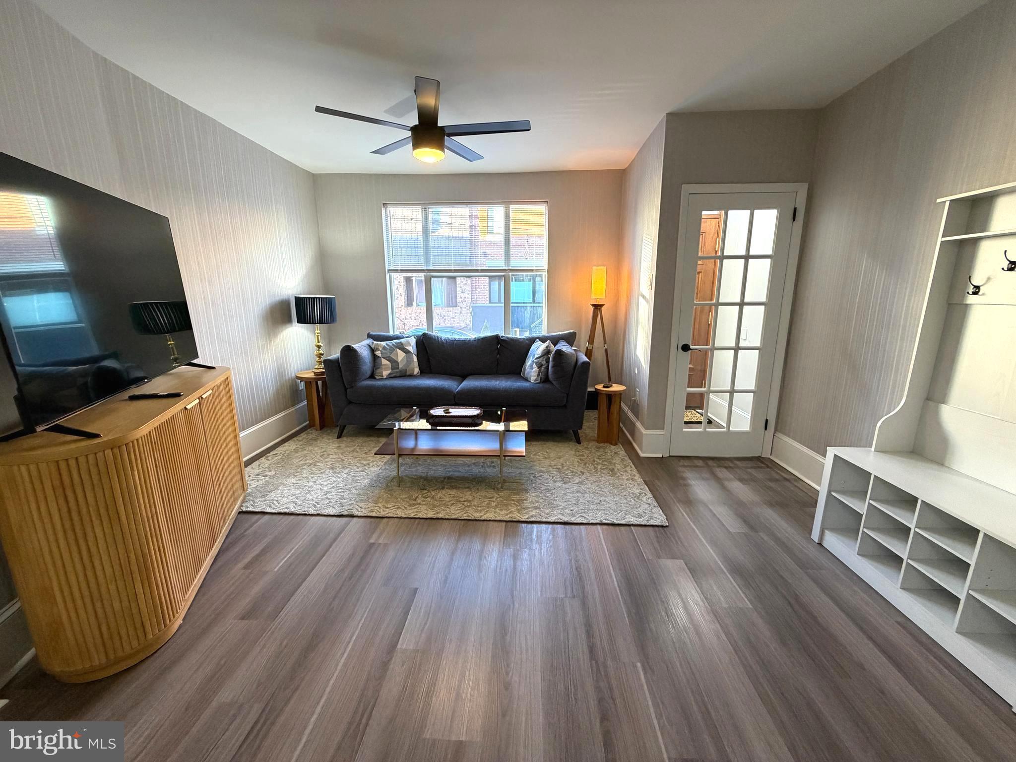 1946 Fitzgerald Street Philadelphia, PA 19145 - Photo 2 of 18 a living room with furniture and a flat screen tv
