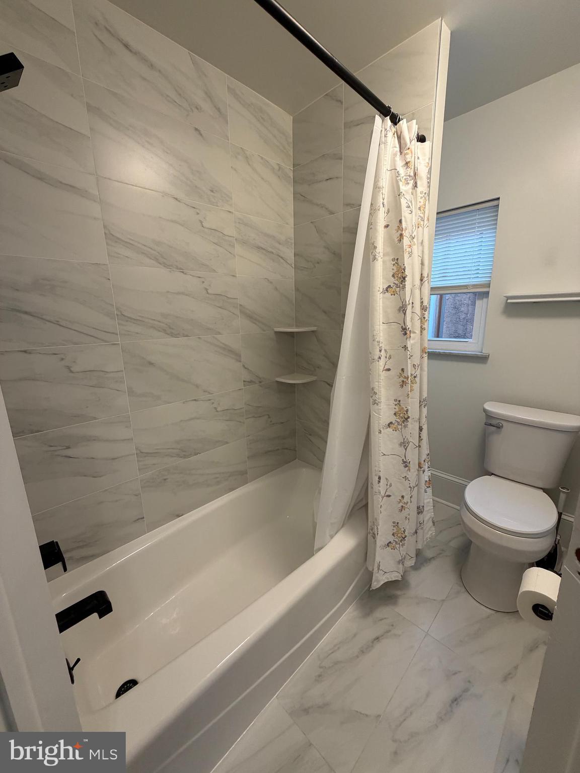 1946 Fitzgerald Street Philadelphia, PA 19145 - Photo 9 of 18 a bathroom with a toilet and a shower