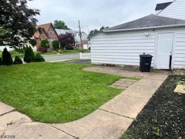 a view of a backyard with sitting area