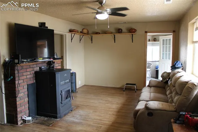 a kitchen with a table chairs and a chandelier